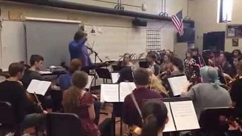 DSA Orchestra and Band members work with Christian...