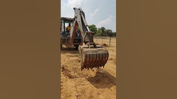 JCB digging to plant coconut tree