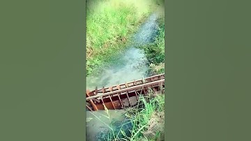 Smart farmer with homemade tools to irrigate rice fields manually #shorts