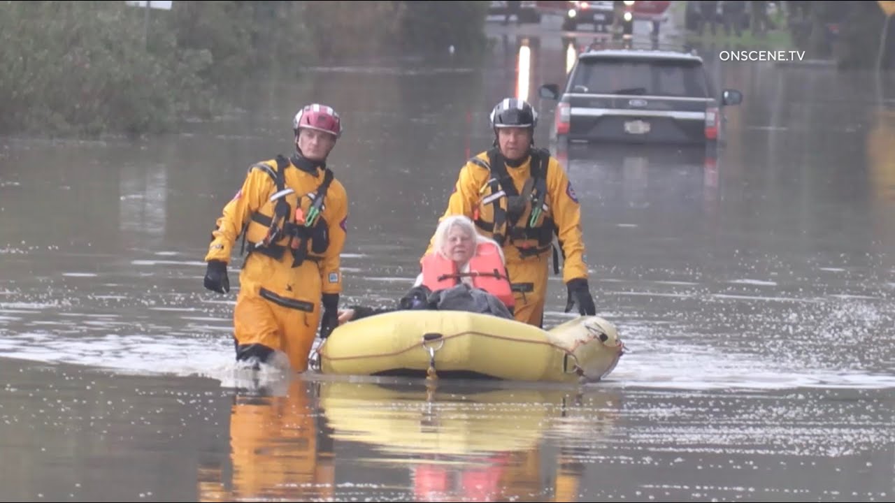 Lifeguards Rescue Woman From Flooded Road | San Diego - YouTube