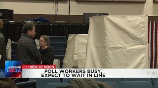 Poll workers see crowds of voters in the early morning
