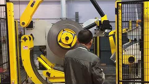 engineer showing how to load coil material