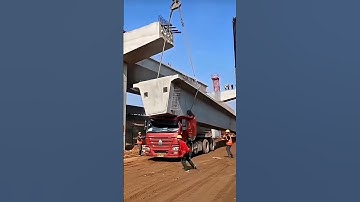 Error in bridge construction! Part of the bridge deck fell onto the truck during lifting!