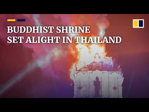 Buddhist pagoda set ablaze by sky lanterns during religious Thai festival