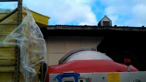Part 1 Eric Hamilton assistant winemaker loading whole cluster grapes into wine press