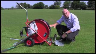 Travelling sprinkler for watering sports pitches