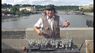 Czech musician playing glass harp. Charles Bridge