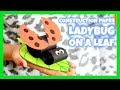 Construction paper ladybug on a leaf spring craft for kids