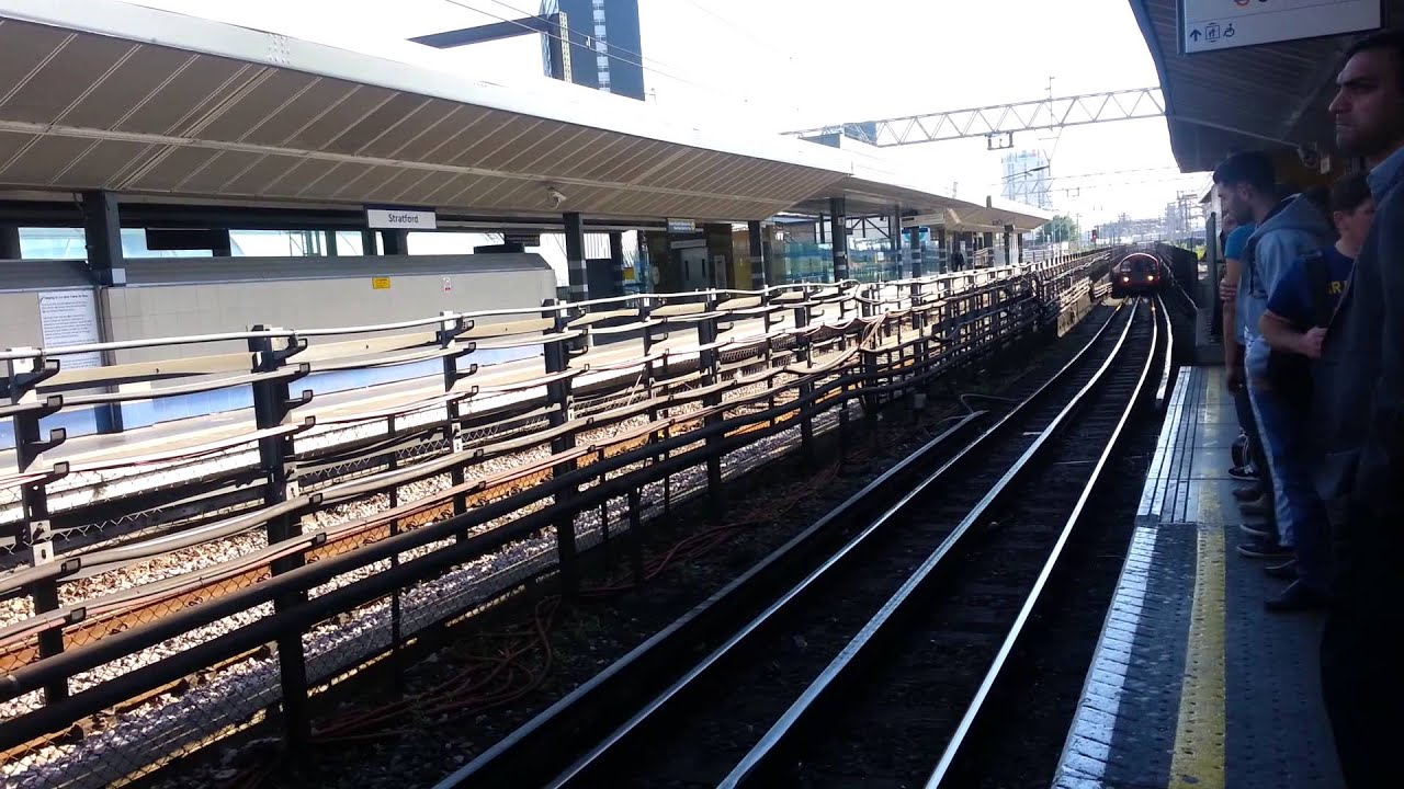 Central Line train stopping at Stratford station, London. YouTube