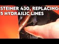 Transaxle hydraulic lines replaced on a steiner 430 joe tractors