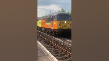 Colas railfreight class 56 at Pontyclun train station with logs