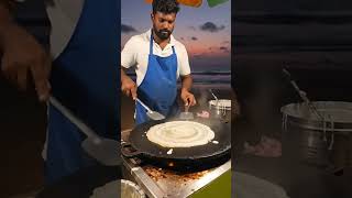 cooking dosa a South Indian food