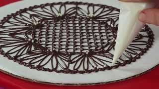 Looking for a quick way to glamorize simple desserts? well then, these
piped chocolate doilies may very be your answer! in this video, i show
how cre...