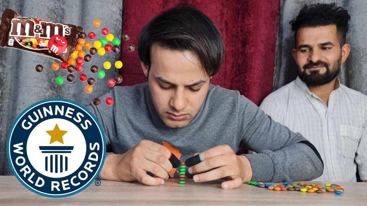 World’s tallest stack of M&M's just got higher - YouTube