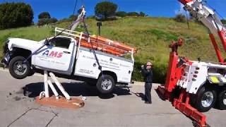 Rotator lifting Utility Truck stuck on pole