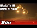 Israeli forces strike Hamas at night as sky over Gaza burns orange