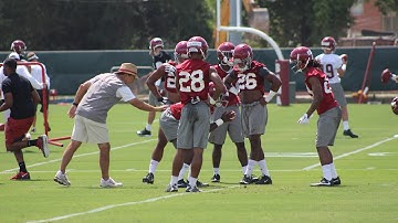 Nick Saban works with Alabama defensive backs at practice