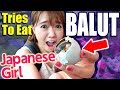 Japanese girl enjoys a balut for the first time