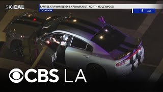 Possibly armed suspect surrenders after leading LAPD officers on pursuit in San Fernando Valley