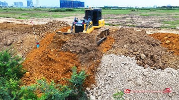 Nice operator use skill shantui dh17c3 dozer technique pushing soil & 25.t dump trucks land filling