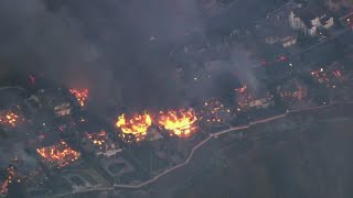 'Coastal Fire' burning homes in Orange County, California
