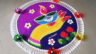 Attractive rangoli for Diwali. हाथ में दिया रंगोली, दीपावली के लिए।