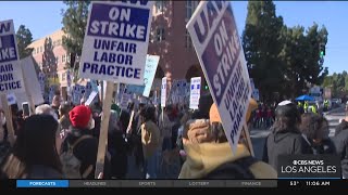 Striking UC workers rally outside UCLA Luskin Center