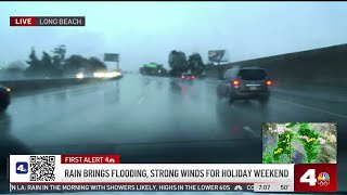 Overnight downpours raise flood threat on LA roads