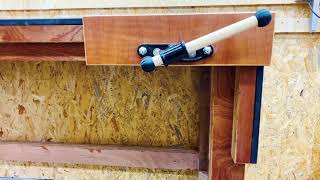 Mobile height-adjustable modular workbench made of plywood and black mdf including dog hole jig.
