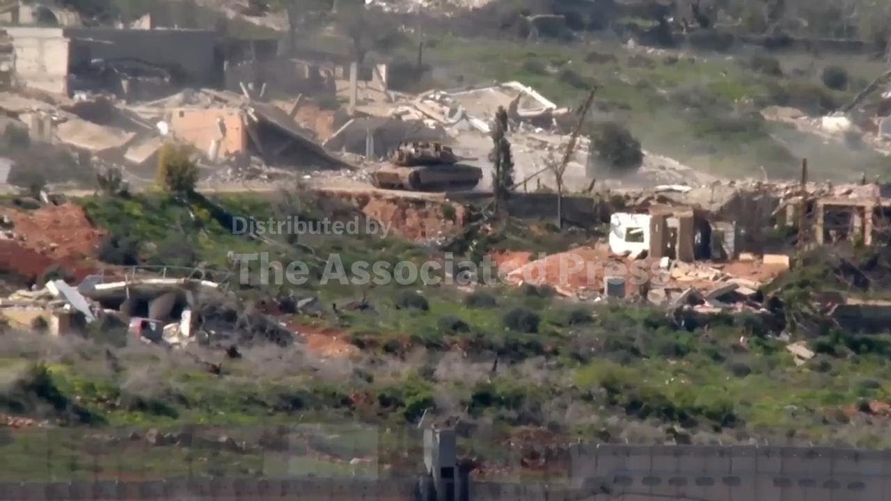 Israeli tanks seen driving through rubble of destroyed buildings in southern Lebanon