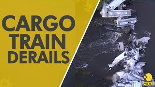 Train derails in NW Iowa, dumping sand, railcars into river