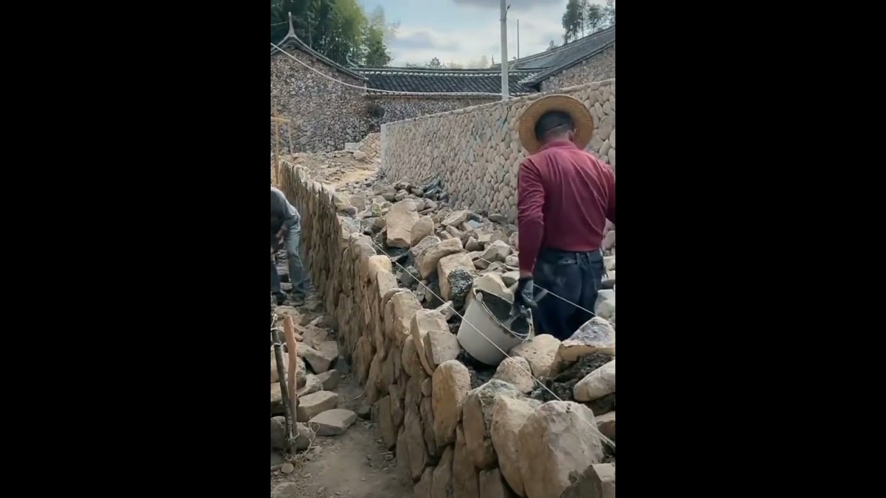 Making rock wall in rural