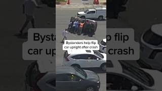 Bystanders help flip car upright after crash