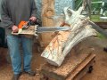 Chainsaw carving a face