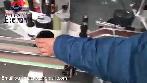 Auto round bottle labeling+top press system from SHANGHAI XUJIE AUTOMATION MACHINERY