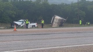 Man survives after dump truck lands on him during crash; other driver killed