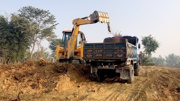 3DX Machine Backhoe Loading Soil In Tripper Dump