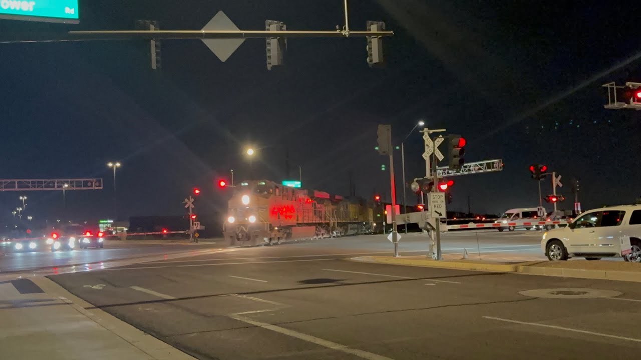 A UP outbound train crosses over Power and Pecos Rd and meets a westbound train at Queen Creek AZ