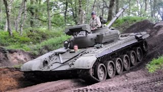 Russian T72 tank driving in the forest