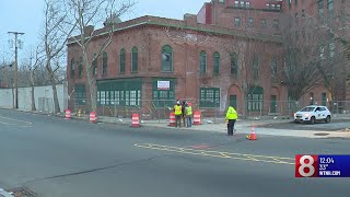 Demolition equipment is set up for a historic building in New Haven despite protests