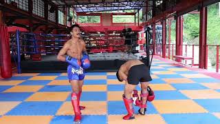 Superbon sparring with young boy. You can learn Muay Thai techniques by watching this video