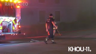 Raw Video: HPD officers rescue security guard from burning building