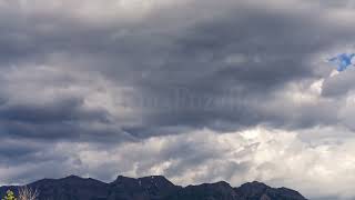 Stock Video - Time lapse of dramatic clouds rolling over Timpanogos mountain