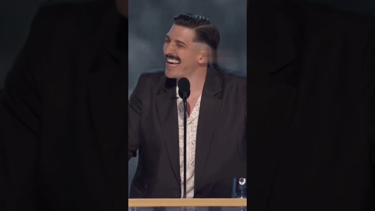 Andrew Schulz roasting Tom Brady.