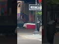 Homeless in New Orleans resting on a full size bed, tents and lots population growing, 2023