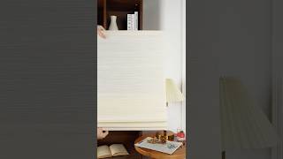 Our Beige Bamboo-Look Roman Shade pairs natural texture with soft, warm light. #homedecor #blind