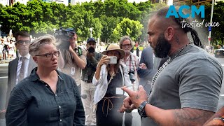 Heated confrontation between Pell supporter and protester outside St Mary's Cathedral