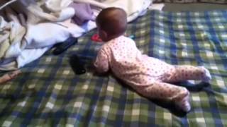 Lilly is doing the army crawl