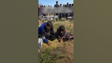 Palestinian children were seen scurrying to collect spilled food in Gaza