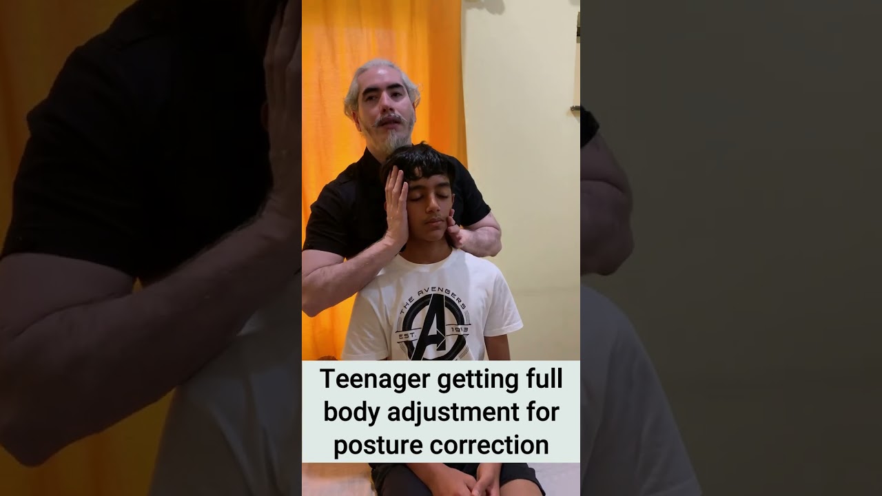 Teenager getting full body adjustment done for posture correction by Dr